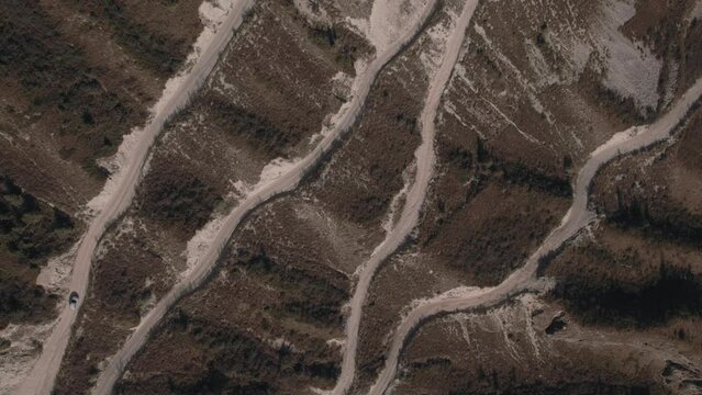 Danger Katu Yaryk pass with traffic cars in Chulyshman valley in Altai, Siberia, Russia. Beautiful summer nature landscape at during daytime. Aerial view from a drone