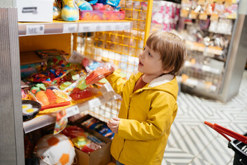 child in the market goes shopping