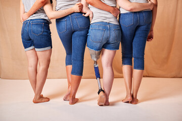 Rear View Of Body Positive Diverse Casually Dressed Women Friends One With Prosthetic Limb