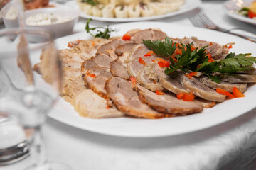 roasted lamb chops with vegetables on the tabble. Braised Lamb Chops. Pieces of roasted lamb chops on the plate. Huge Roast Pork Chops, Fillet, Joint or Loin in a Plate with Garnish