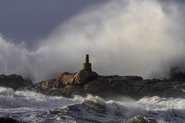 Fototapeta na wymiar Geodesic landmark under heavy sea storm