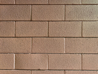 closeup brown tan solid block brick wall cement cinder blocks exterior building