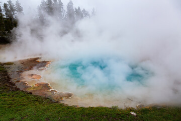 Hot spring Geyser with colorful water in American Landscape. Celestine Pool in Yellowstone National Park, Wyoming, United States. Nature Background.