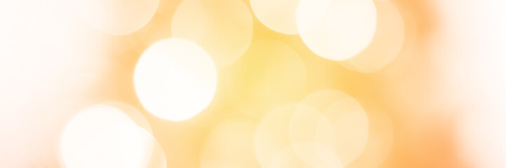Summer orange sparkling glitter bokeh background, banner texture. Abstract defocused lights header. Wide screen wallpaper. Panoramic web banner with copy space for design