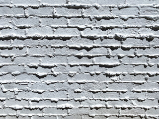 vintage old white painted alley cinder block brick wall building exterior shadows retro style