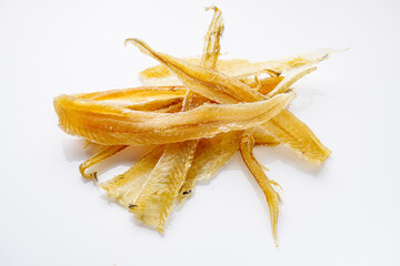 dried fish beer snack on a white acrylic background