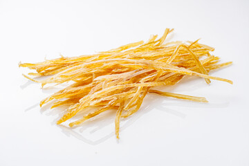 dried fish beer snack on a white acrylic background