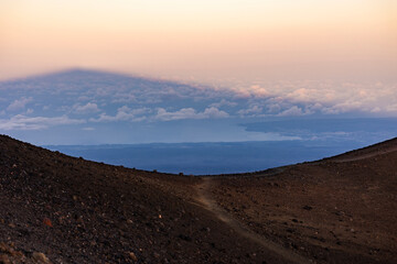 Fototapeta premium Shadow of Mauna Kea over Hilo at Sunset in Hawaii