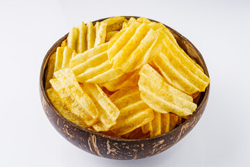 golden crispy potato chips on a white background
