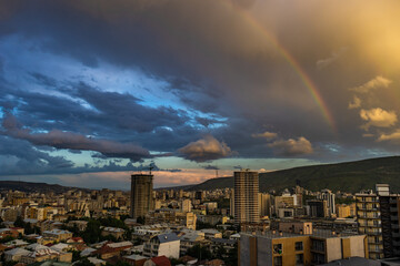Dramatic evening sky with rainbow