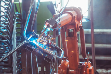 Welding robot produces a product in a factory