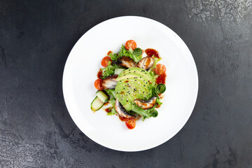 Salad with eel, avocado and herbs.