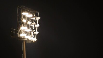 Stadium lights on in the rain at dark night - Powered by Adobe