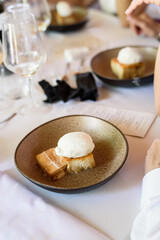 Traditional torrija brioche with vanilla ice cream, typical Spanish dessert.