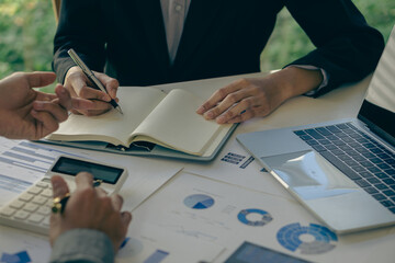 Business team meeting to meet professional investors working on new marketing business strategies. Project discussion and data analysis, charts and graphs, finance and accounting with the laptop.