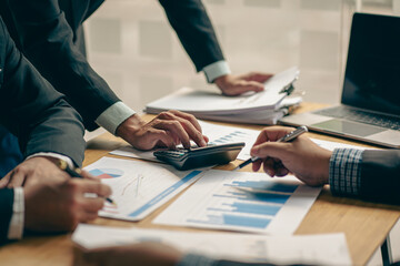 Business team meeting to meet professional investors working on new marketing business strategies. Project discussion and data analysis, charts and graphs, finance and accounting with the laptop.