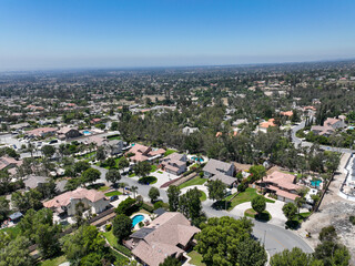 Fototapeta na wymiar Aerial view of wealthy Alta Loma community and mountain range, Rancho Cucamonga, California, United States