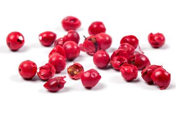 pink peppercorns isolated on white background