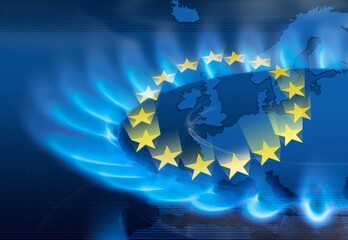 The blue flame of a gas stove in the dark. Gas burner on the background of the flag of the European Union. The concept of gas consumption in Europe