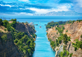 Beautiful landscape of the Corinth Canal in a bright sunny day against a blue sky with dramatic...