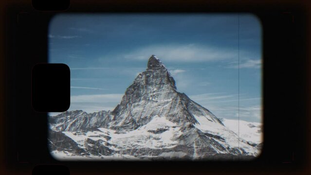 Retro video camera screen with Matterhorn mountain in national park of Zermatt, Switzerland. Summer landscape with clear blue sky and sunshine weather
