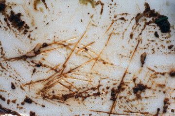 Empty box of eaten takeaway food. Just a dirty box and cutlery left after enjoying a meal of delicious Mexican enchilada to go. Popular and inexpensive way to eat out. Closeup color image.