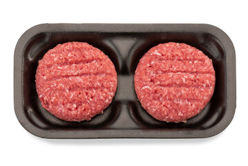 Raw fresh beef burgers for hamburger in black plastic tray isolated on white, clipping path included, top view