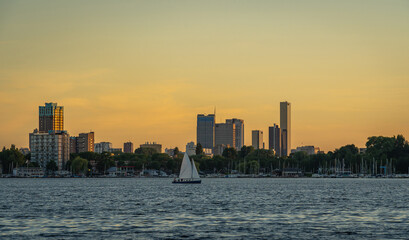 Skyline of Rotterdam by sunset with lake Kralingen in the foreground