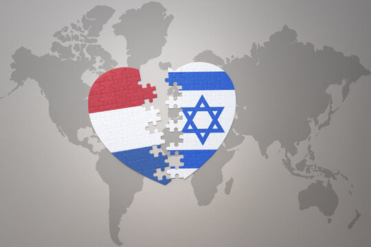 puzzle heart with the national flag of israel and netherlands on a world map background.Concept.