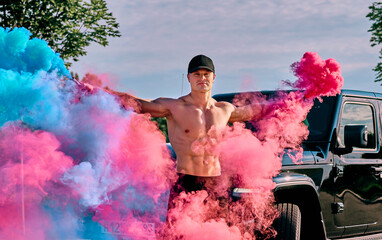 man with smoke bombs near the car