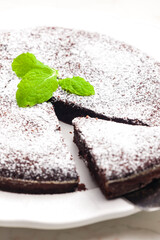 still life of chocolate cake with sugar