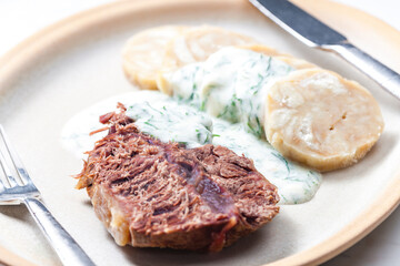beef meat with dill sauce and dumplings