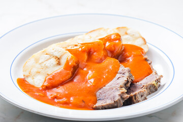 beef meat with tomato sauce with dumplings