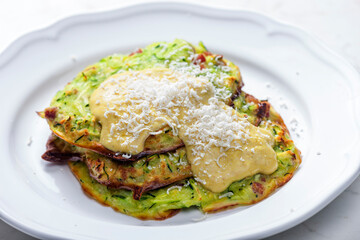 zucchini cakes with mustard sauce and parmesan cheese