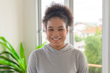 Fototapeta premium Portrait of mixed race smiling woman teen