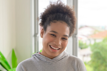 Fototapeta na wymiar Portrait of mixed race smiling woman teen