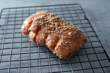 A view of a cinnamon crumb bear claw.