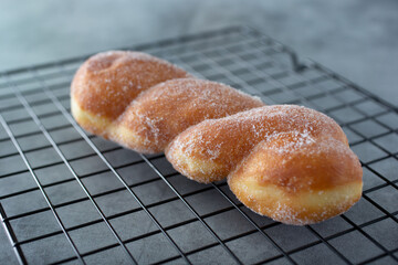 A view of a cinnamon twist donut, or a sugar twist donut.