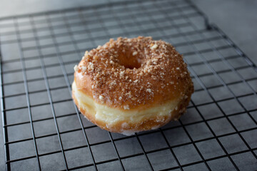 A view of a cinnamon glazed donut.