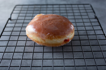 A view of a raspberry jelly filled donut.