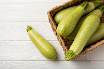 Squash vegetable marrow zucchini on white texture background.Vegetarian organic vegetables.Healthy food.Copy space.Place for text
