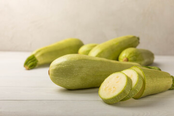 Squash vegetable marrow zucchini on white texture background.Vegetarian organic vegetables.Healthy food.Copy space.Place for text