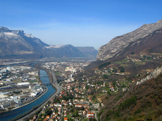 Grenoble. View of the city from above from a great height from the Bastille fortress. Mountains...