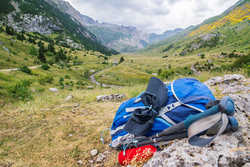 Fototapeta na wymiar Backpack and hiking equipment in the Otal Valley, Ordesa y Monte Perdido national park.