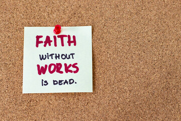 Faith without works is dead, a handwritten note message on pinning board with copy space. Christian...