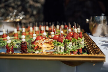 A wide variety of snacks on the table for guests. Shrimp, boiled pork, various types of meat and other products