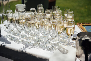 Glasses of champagne at the Banquet, white sparkling wine in wine glasses, festive mood