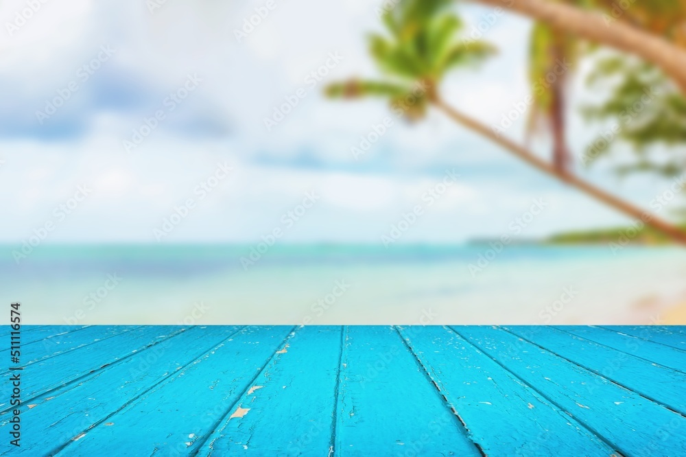 Sticker Top of wood table with seascape and palm tree, tropical beach background. summer vacation background concept.