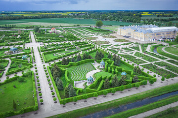 Aerial view on baroque garden of Rundale palace in summer time. Symmetrical park in vibrant green colors. - obrazy, fototapety, plakaty
