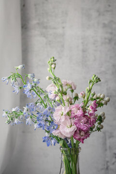 Close-Up of Bouquet of Blue Bellflowers, Pink Stock, and White Hypericum Berries